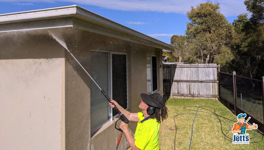 Cleaning gutters using the pressure wand